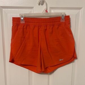 Reebok Women's Bright Orange Athletic Shorts